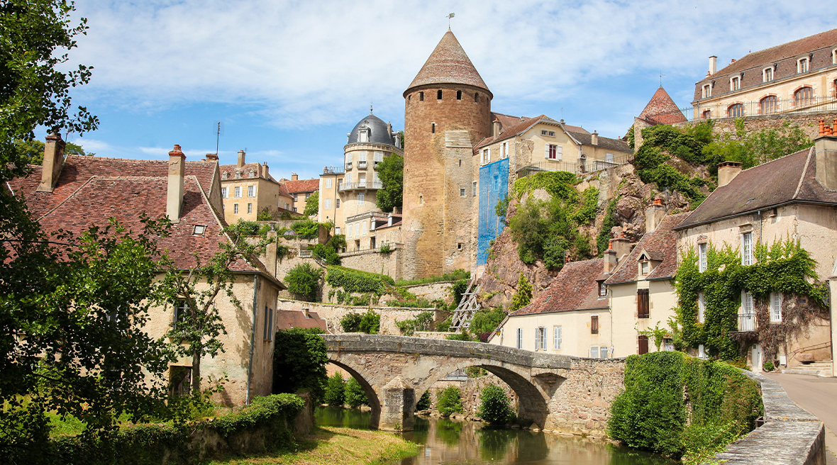 Picturesque French town with bridge over river
